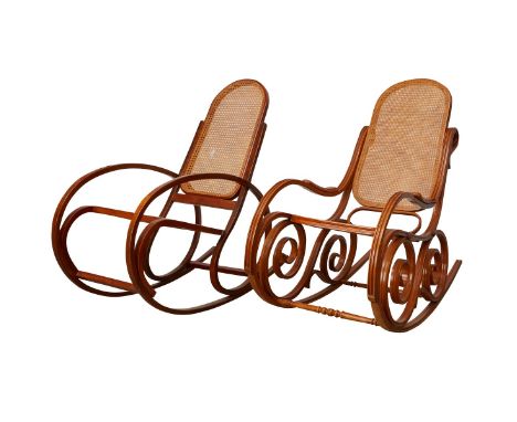 Group of two Thonet style bentwood and caned rocking chairs. Kohn would later merge with Thonet to become one of the largest 