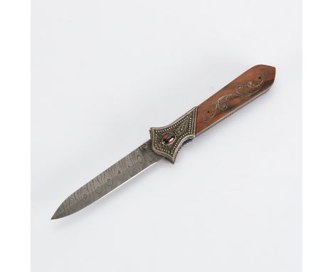 Zaza Revishvili (Georgian, 20th/21st c.) Folding hunting knife with a Damascus steel blade. The wooden handle is decorated wi