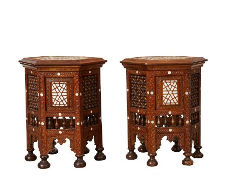 Pair of Syrian mother of pearl inlaid wooden hexagonal side tables. The carved wood is inlaid with intricate geometric design