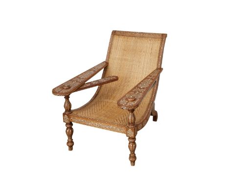 Syrian mother of pearl inlaid colonial style plantation chair with two swinging arms that extend outwards. The wood is inlaid