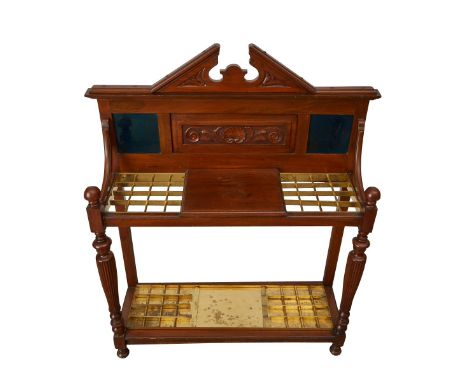 Victorian mahogany hall stand with brass slots for umbrellas or canes. The lower shelf with a brass drip tray. The back with 