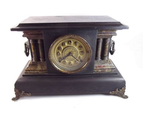 A Victorian black painted and marbled wooden mantel clock