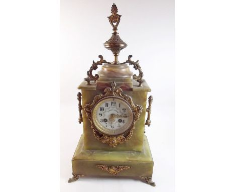 A 19th century onyx and gilt metal mantel clock with porcelain floral painted dial by Schiever and Lackamp