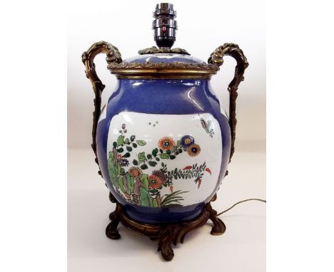 A 19th century Chinese jar and cover painted famille verte reserves of garden flowers on a powder blue ground, later converte
