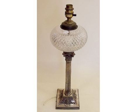 A Victorian silver plated Corinthian column form table lamp converted from an oil lamp, with cut glass reservoir, total heigh