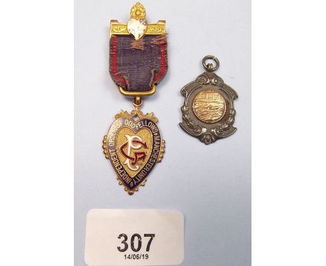 A 9 carat gold and enamel Oddfellows Masonic jewel 14g total and a silver swimming medal