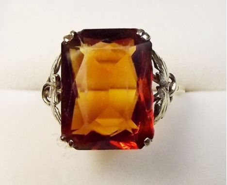 A 9 carat gold ring set orange stone, size O