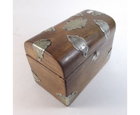 An oak dome top tea caddy with silver plated mounts engraved 'Tea' to top