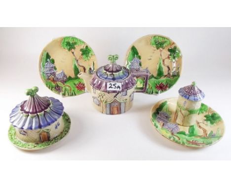 A group of six items by Mabel Leigh comprising: Pagoda teapot, sugar castor, butter dish and three plates