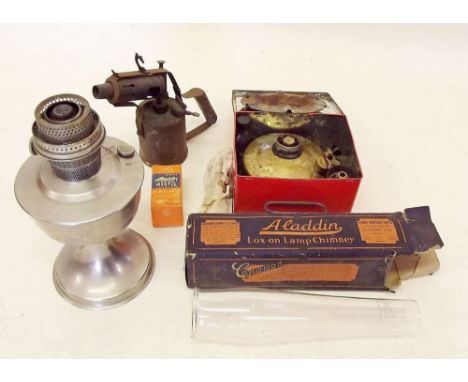 A blow torch, aladin lamp and primus stove