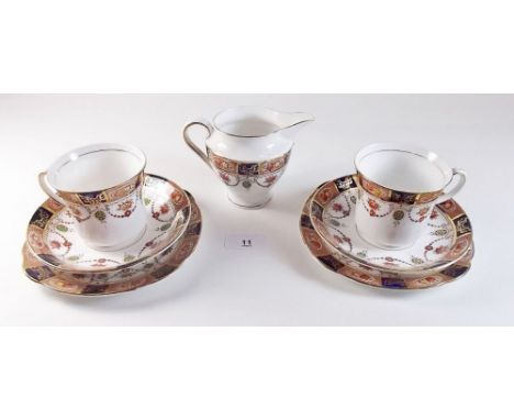 An Edwardian Colclough tea service comprising six cups and saucers, six tea plates and jug