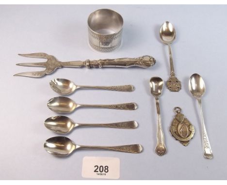 A group of silver cutlery - 60g, and a napkin ring and a medal 47g