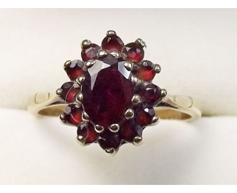 A 9 carat gold garnet set ring, size O 1/2