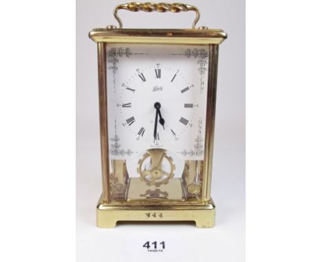 A Schatz brass carriage clock with visible escapement