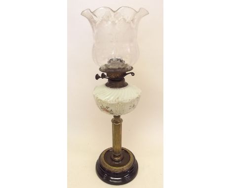 A Victorian oil lamp with floral painted vaseline glass reservoir and etched glass shade