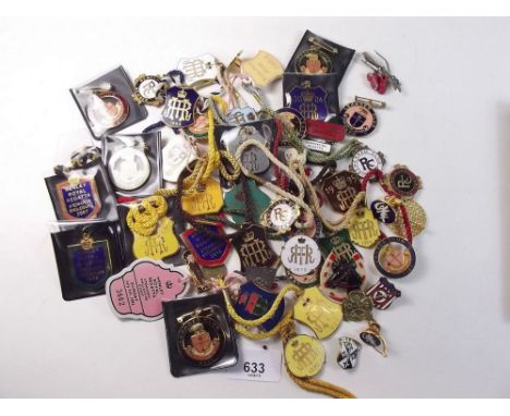 A box of enamel racing badges