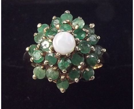 A 9 carat gold emerald and opal ring - size J