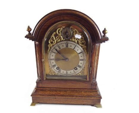 An early 20th century oak cased striking bracket clock with fast/slow dial - 30cm