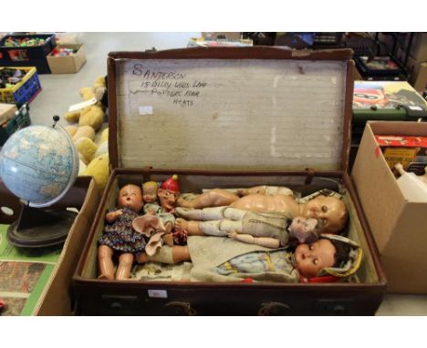 Leather case containing vintage dolls