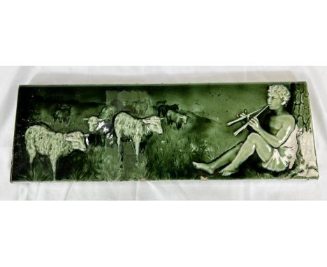 A 19th Century Minton's style green glaze tile of Shepherd playing instrument for sheep 15 x 46cm