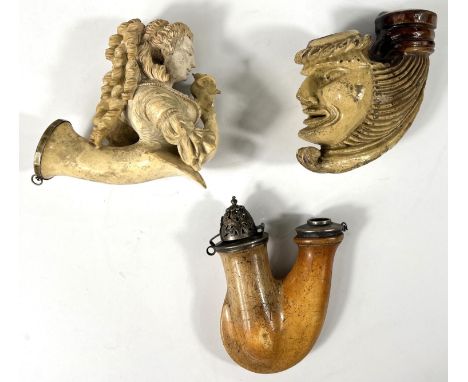 3 pipe bowls including:- an unusual brown and cream bowl depicting a grotesque face (firing cracks), scrolled mount glued; a 