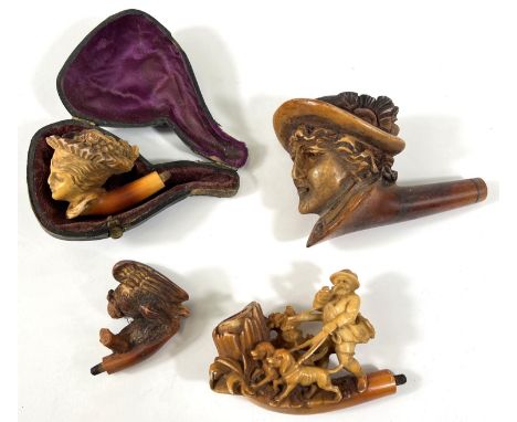 4 Meerschaum pipe bowls, 2 depicting women's heads, man walking dogs and an eagle on a rock (one with case).