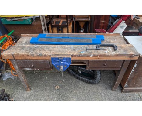A vintage work bench with drawers, an Irwin record 52 1/2 clamp and another clamp.