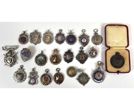 A collection of hallmarked silver enamel and other sporting medallions and fobs for darts, cricket, life saving etc. gross we