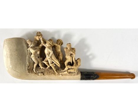 A large amber and Meerschaum pipe, the bowl and stem depicting merry dancing figures and a preacher. Length 30cm.