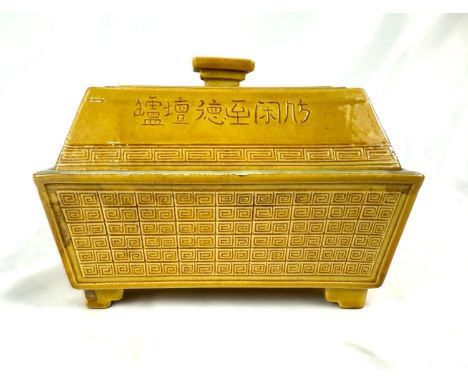 A Chinese yellow ground ceramic lidded censor with incised geometric decoration, incised mark to based, length 14cm.