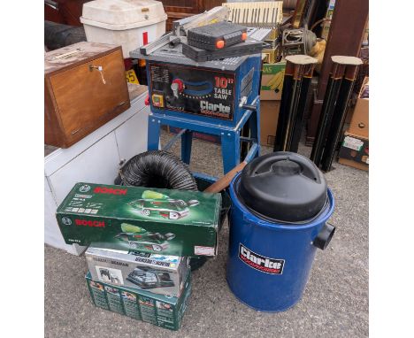 A bench saw and modern boxed tools.