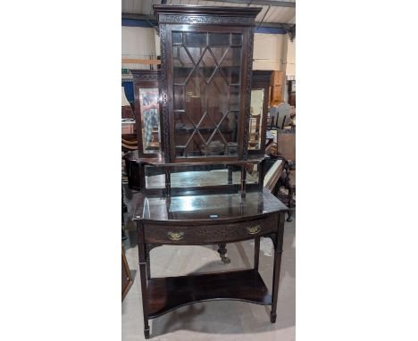 An Edwardian Chippendale style mahogany display cabinet with blind fret and pierced decoration, the mirror back upper section