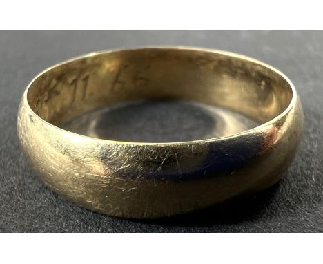 A 'D' shaped yellow metal wedding ring with internal inscription, stamped 18ct, 3.7gms