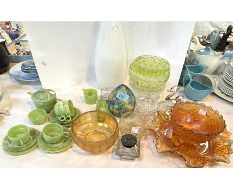 A Bakelite tea service and a selection of coloured glass.