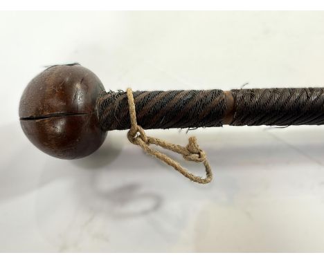 A carved wooden and wire wrapped chief's knobkerrie