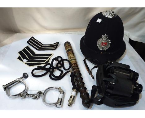 A Police truncheon commemorating the General Strike May 1926; a vintage Police helmet, handcuffs, whistle etc.