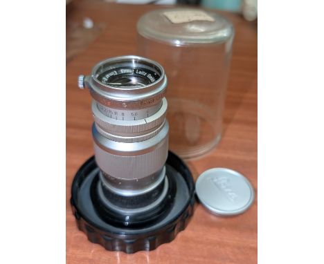A Leica Elmar Ernst Leitz GmbH Wetzlar f=9cm 1:4 Nr1182183 telephoto lens in plastic case.
