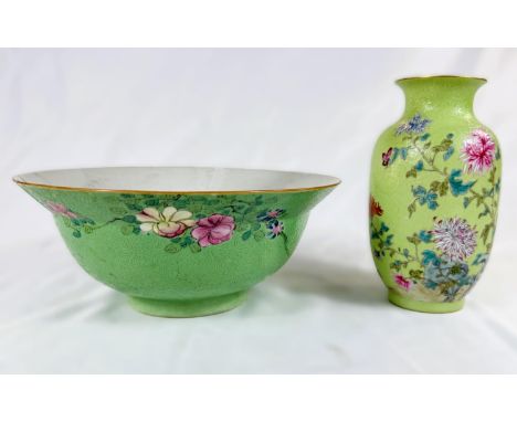A Chinese lime green vase decorated with polychrome chrysanthemums, incised wave pattern, seal mark to base, and a similar Ch