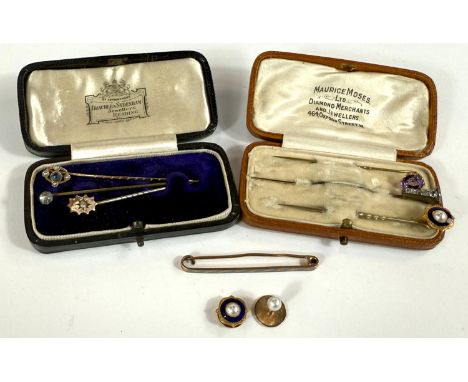 Six gem-set stick pins; a tie clip stamped "559"; two pearl set studs.