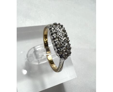An 18ct gold dress ring with twelve diamonds in illusion setting, 3.3gm