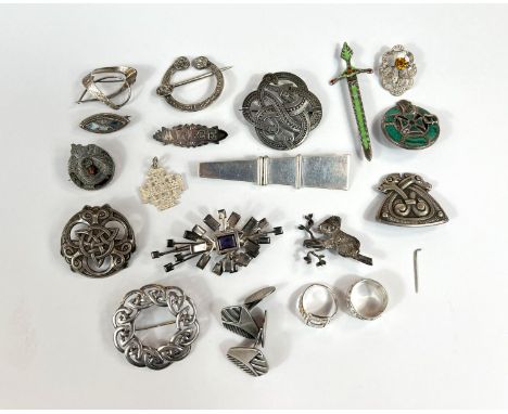 A collection of silver Scandinavian and Celtic brooches etc