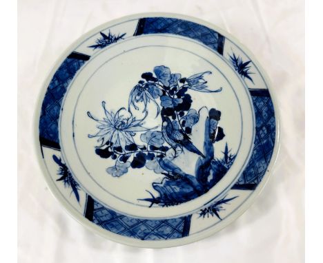 A late 19th Century Chinese blue and white ceramic dish with bird on flowers, diameter 27cm.