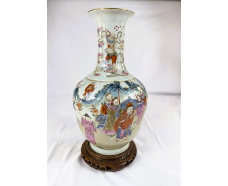 A Chinese Famille Rose vase decorated with polychrome figures of people collecting flowers, with seal mark to base, on associ