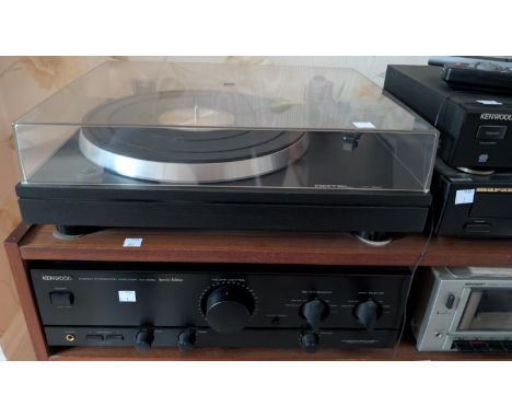 A Mariantz CD player; a Kenwood Amplifier and radio; a Rotel record deck and two speakers.
