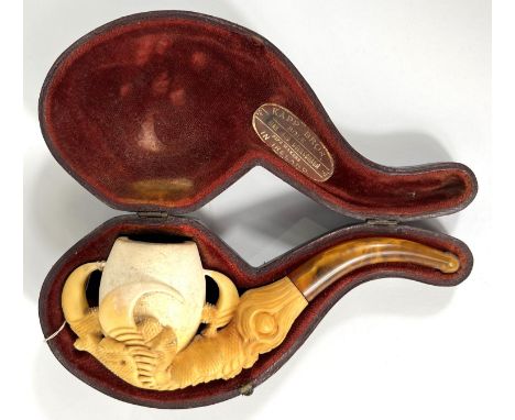 A cased amber and Meerschaum pipe in the form of a claw &amp; egg, length 16cm.