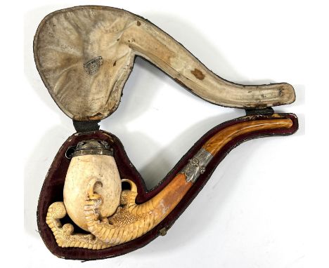 A large cased amber and Meerschaum pipe with egg and claw bowl and white metal mounts, length 22cm.