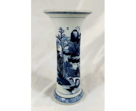 A Chinese Kangxi period blue and white beaker vase, circa 1700, with traditional scenes, flared rim, height 24cm.