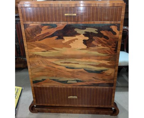 An Art Deco style inlaid converted drinks cabinet with up and over front door, drawers above and bellow, height 124cm width 9