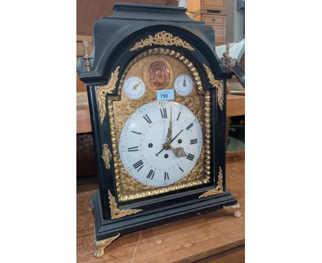 An 18th/19th century ebonised caddy top&nbsp; bracket clock with extensive ormolu mounts, with convex enamel dial and gilt su