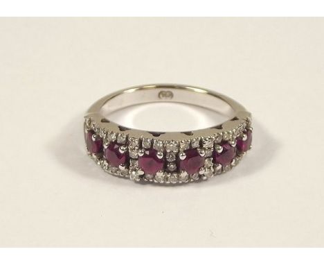 RUBY RING.
An 18ct. white gold half hoop ruby & diamond ring. Size R/S. 7.5g.